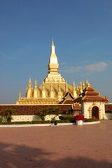 Fototapeta premium Great Stupa, gold covered large Buddhist stupa in the centre of the city of Vientiane, Laos