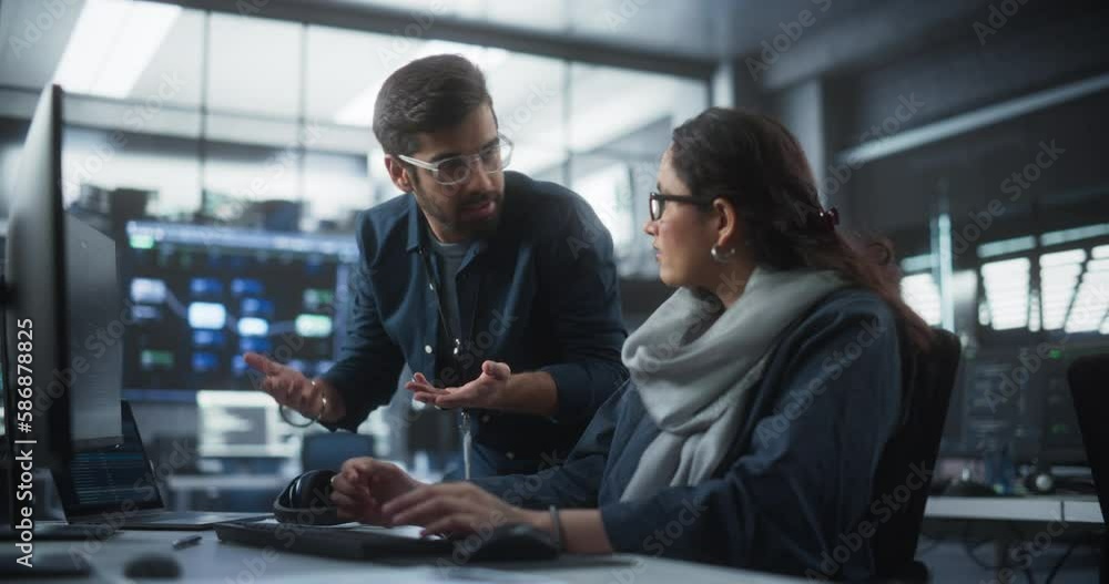 Aufkleber Two Diverse Multiethnic Indian Colleagues Having a Conversation While Busy Working on a Software Development Project. Female Engneer Talking with a Project Manager. Teamwork in Technology Laboratory