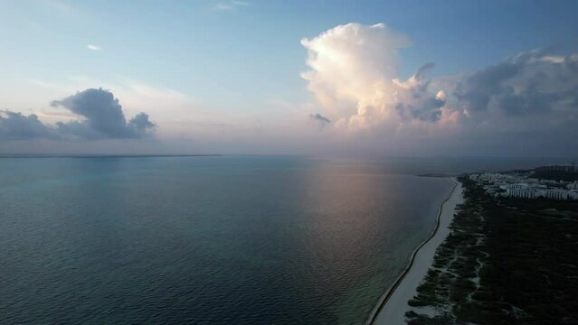 Sunrise fly over the waters of the Gulf of Mexico. Located in Cancun, Mexico. Aerial 4K drone video