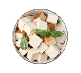 Bowl of delicious smoked tofu cubes with basil isolated on white, top view