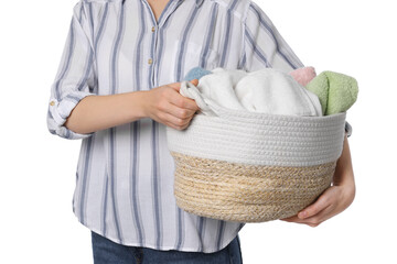 Woman with basket full of clean laundry on white background, closeup