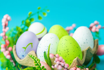 Fototapeta na wymiar multi-colored painted Easter eggs on a blue background 