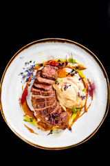Roasted Duck breast fillets with vegetable pure in plate