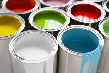 Cans of different colorful paints as background