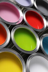 Cans of different colorful paints as background