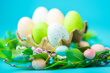 multi-colored painted Easter eggs on a blue background