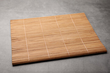 New clean bamboo mat on grey table