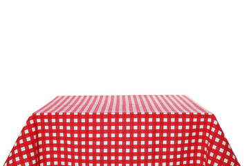 Table with red checkered tablecloth isolated on white