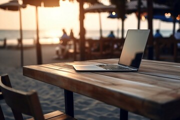 Beach Workplace Mockup. Learning and Doing Business Outdoors with Laptop, Notebook and Technology on Table with Blurry Background and Copy Space