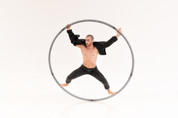 Cyr wheel artist in white room
