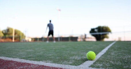 Tennis match and serving player on tennis court. Tennis game and sports training