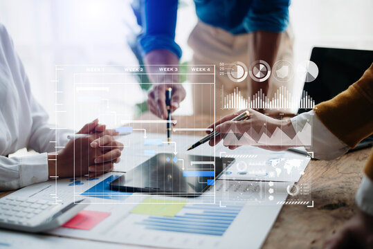 Businessman hand Project manager working and update tasks and Gantt chart scheduling virtual diagram.with smart phone, tablet and laptop