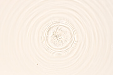 Fototapeta na wymiar Water surface abstract background texture with splashes and bubbles. Beige color