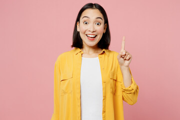 Young fun insighted smart proactive woman of Asian ethnicity wear yellow shirt white t-shirt...
