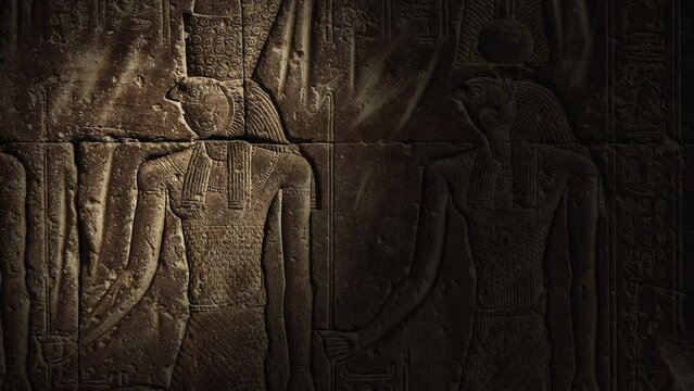 Light spot moving on ancient egypt carving image of Horus god on wall of temple, 4k