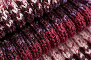 Knitted scarf close-up. Texture background in the form of a knitted fabric from colorful...