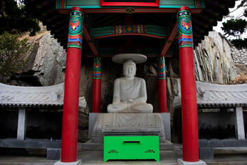 Ancient stone buddha in Yonggung shrine for korean people travelers travel visit and respect praying blessing wish holy mystery in Haedong Yonggungsa temple at Gijang in Busan or Pusan of South Korea