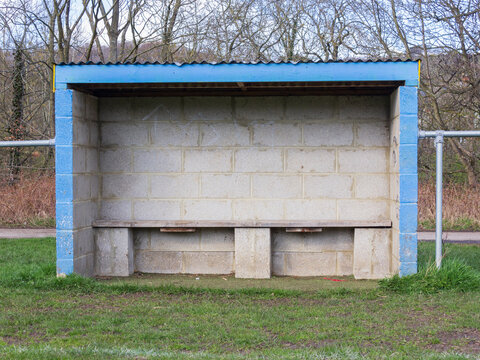 The dug out beside an amateur soccer pitch ready for the team coach, trainer and substitutes - Powered by Adobe