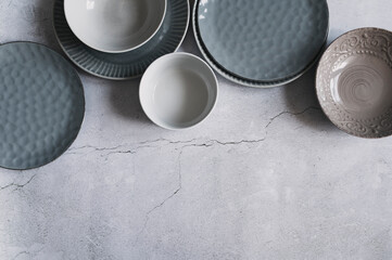 modern dishware collection in rustic grey and beige tones. Trendy ceramic plates.