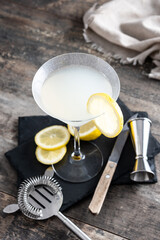 Lemon drop martini cocktail on wooden table