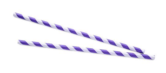 Striped paper cocktail straws on white background, top view