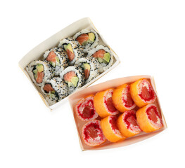 Food delivery. Paper boxes with different delicious sushi rolls on white background, top view
