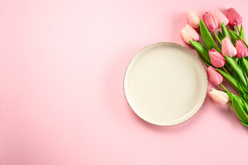 woman day card white plate and flowers on pink background