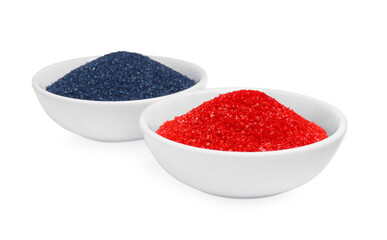 Bowls with food coloring on white background