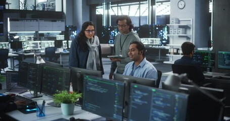 Team of Three Young Indian Software Engineers Use Computer to Discuss a Technological Project in Modern Industrial Office. Male and Female Scientists High Five and Celebrate Successful Test Result