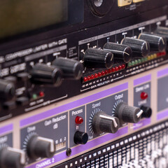 Recording studio gears in rack close up. Selective focus.