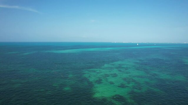 Flying over the waters of the Gulf of Mexico. Located in Cancun, Mexico. Aerial 4K drone video