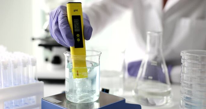 Scientist used chemical solution and lab test water quality or pH meter in lab. Water research and scientific