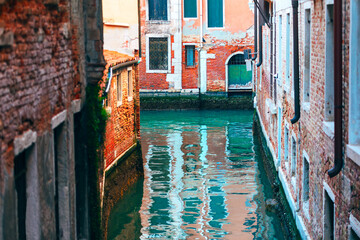 Venice typical view of water canal . Houses situated on the water 