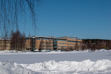 Fototapeta na wymiar UMEA, SWEDEN - MARCH 29, 2023: Umea university building. Taken on a sunny winter day.