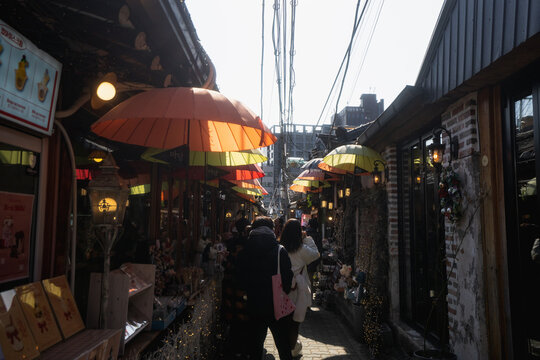 Ikseondong Hanok Village , traditional walking street with umbrellas during winter afternoon at Ikseondong , Seoul South Korea : 3 February 2023
