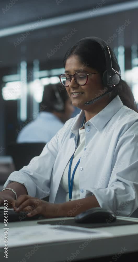 Aufkleber Vertical Screen: Portrait of a Help Desk Specialist Having a Conversation on a Call, Providing Technical Support to Client Experiencing Software Issues. Indian Female Using a Headset