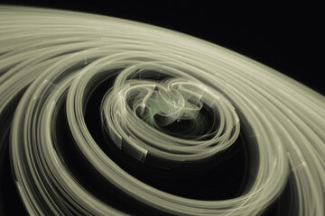 Olive swirling pattern of crooked waves on a black background. Abstract fractal 3D rendering