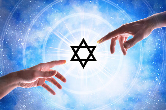 Hands pointing jew symbol with blue universe background