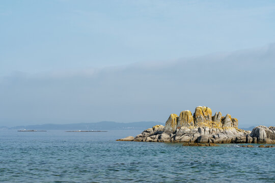 Rocks and troughs in Ria de Arousa, Ribeira, A Coruña province, Galicia, Spain