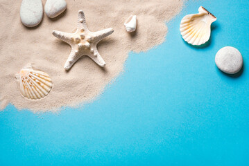 Fototapeta na wymiar Summer background with pebbles, starfish and sea shells