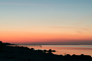 Scandinavian sunset,  orange sky, silhouette