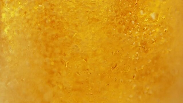Super slow motion of pouring beer into pint in motion. Filmed on high speed cinema camera, 1000 fps. Camera placed on high speed cine bot. Speed ramp effect.