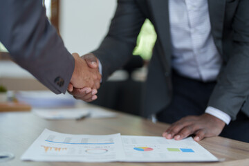 african american and asian people hand shaking successful corporate partnership deal welcoming opportunity in office agreement professional greeting meeting colleagues partners