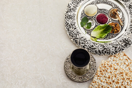 Composition with symbolic Passover, Pesach, items and meal on vintage background,