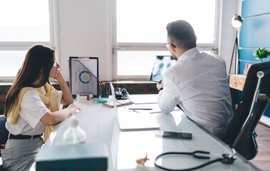 Fototapeta premium Male doctor showing chest X ray to patient