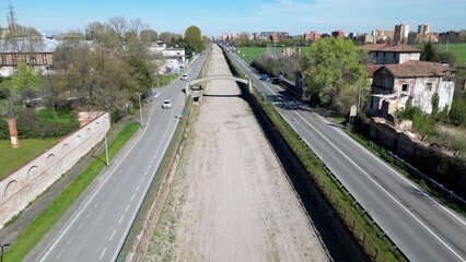 Italy , Milan 2023  -  Drone aerial view of drought and aridity in Navigli canal river  - water emergency and reduction of water consumption - Climate change global warming 