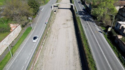 Italy , Milan 2023  -  Drone aerial view of drought and aridity in Navigli canal river  - water emergency and reduction of water consumption - Climate change global warming 