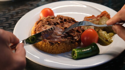Stuffed lamb with appetizers on the presentation plate