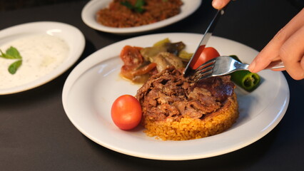 Stuffed lamb with appetizers on the presentation plate