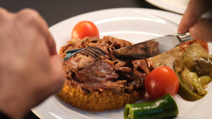 Stuffed lamb with appetizers on the presentation plate